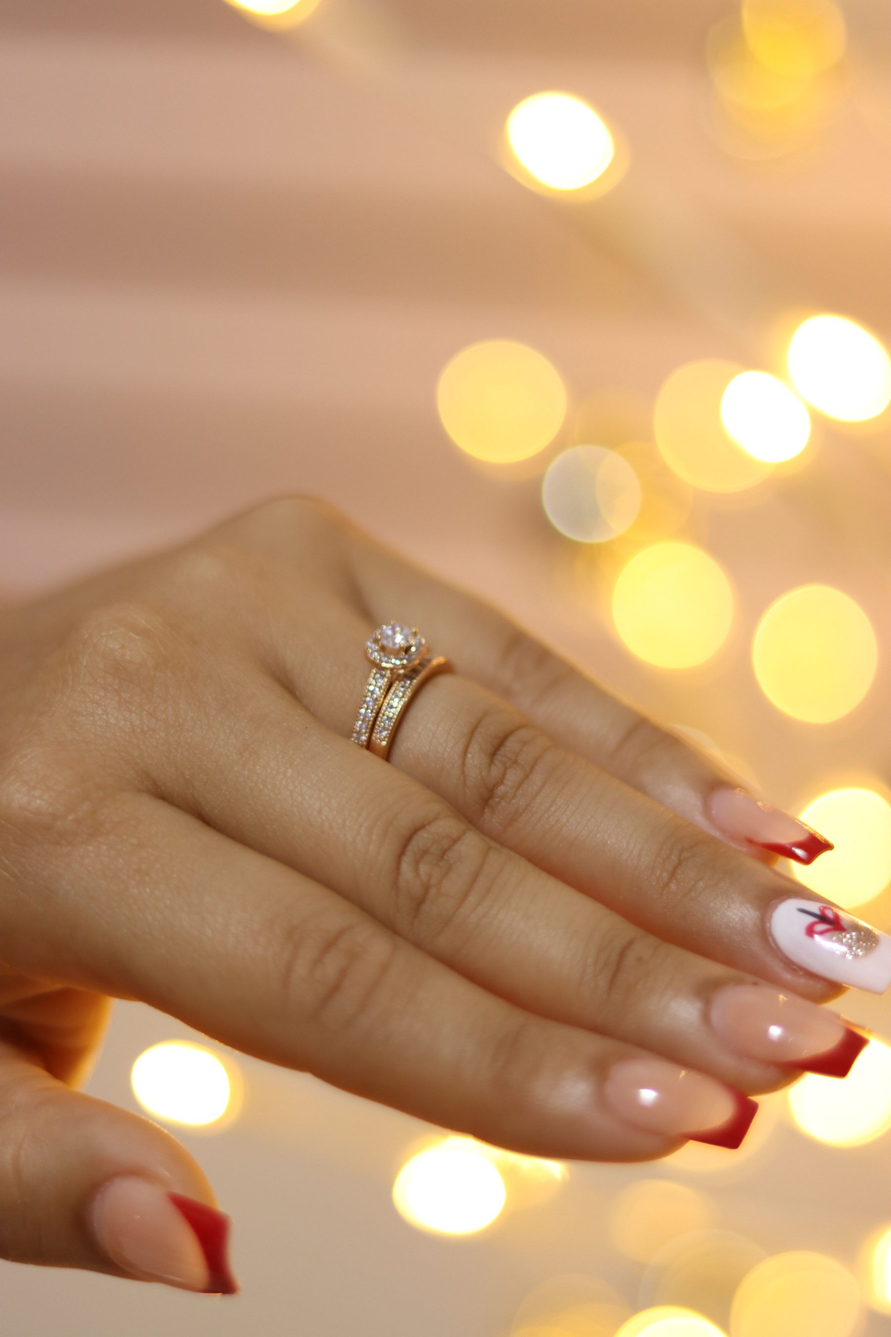 Manicured hand with polished nails in warm light